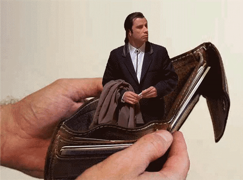 tavolta looking around in wallet 
