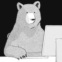 bear behind computer 