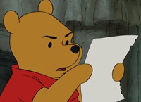 pooh confused reading paper 
