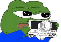 pepe holding camera upside down 